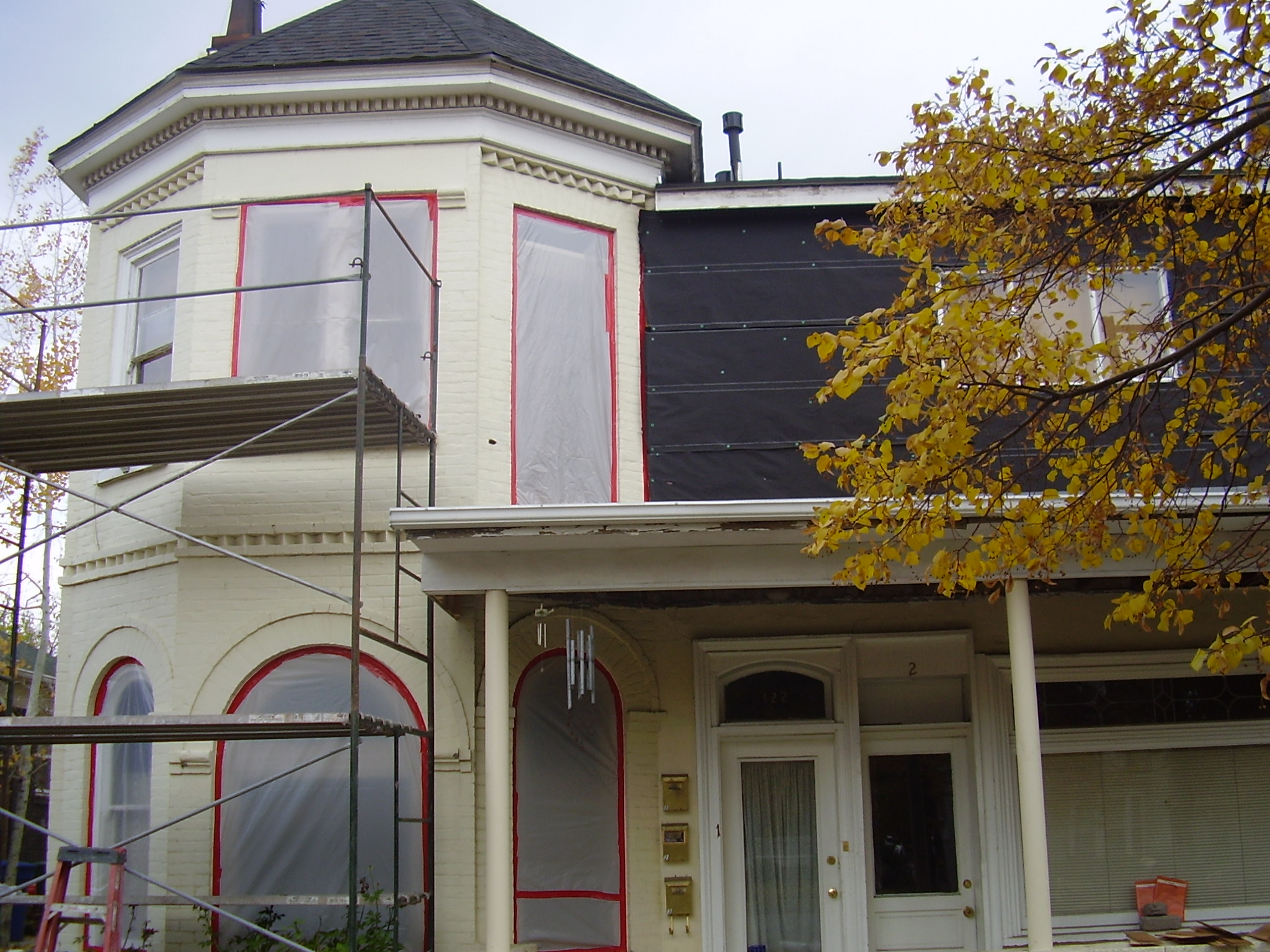 before paint removal on historic home-painted white