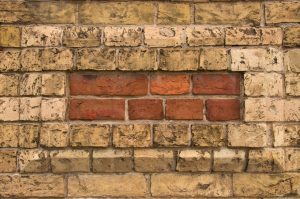 masonry bricks in stone wall