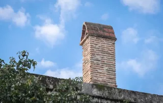 Historic chimney featuring brickwork.